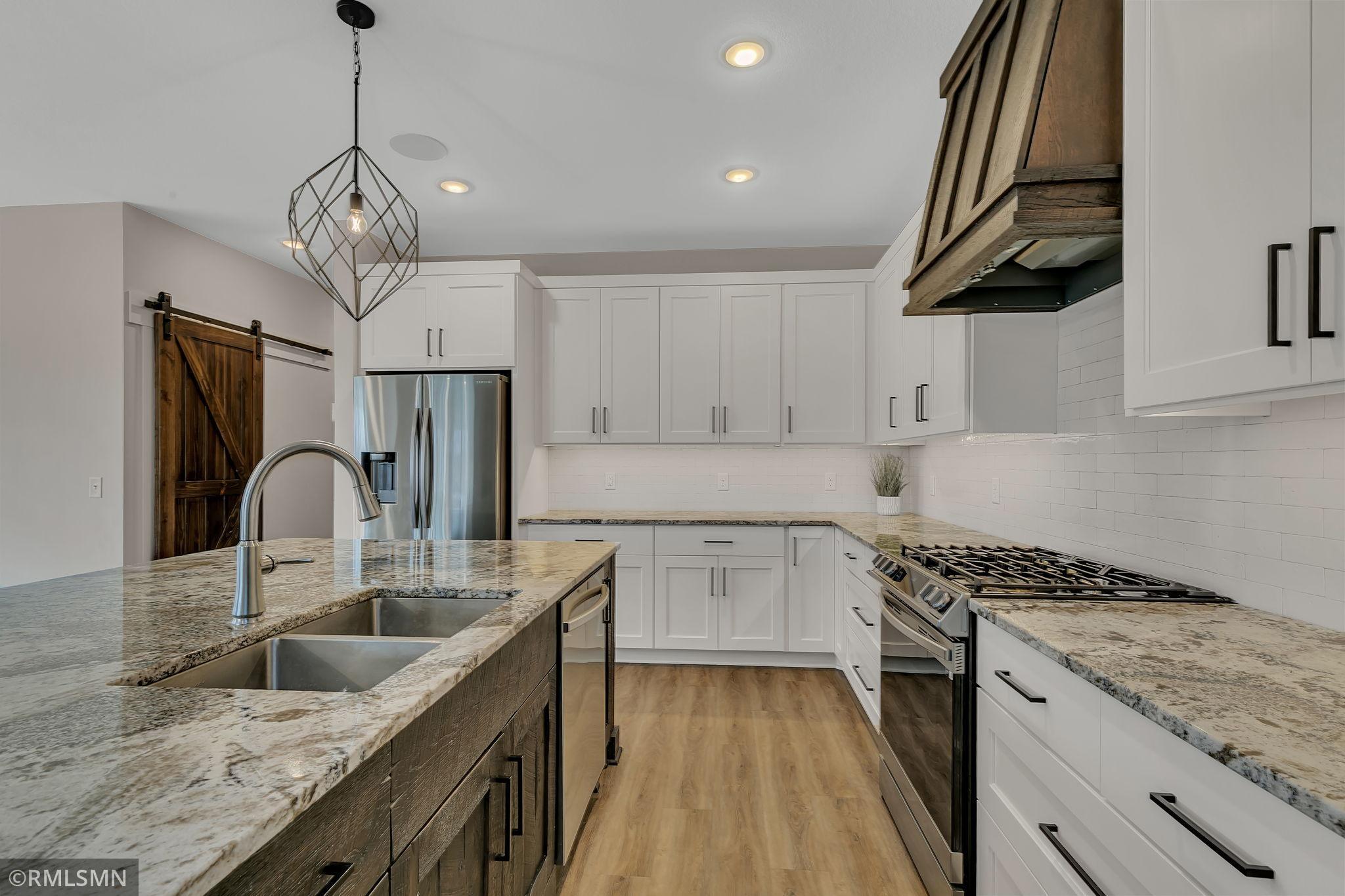 Well designed kitchen, walk-in pantry door on the left