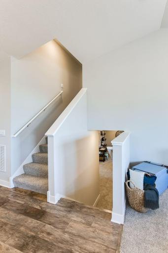Just seven small steps to the finished lower-level rec room! Photos of model home. Colors and options may vary. Ask Sales Agent for details.