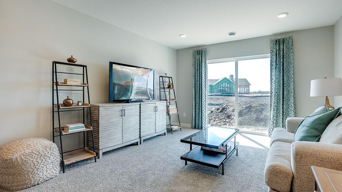 View of the lower level family room with the ability to walk-out into your rear yard! Photo is of model home. Colors and options may vary. Ask Sales Agent for details.