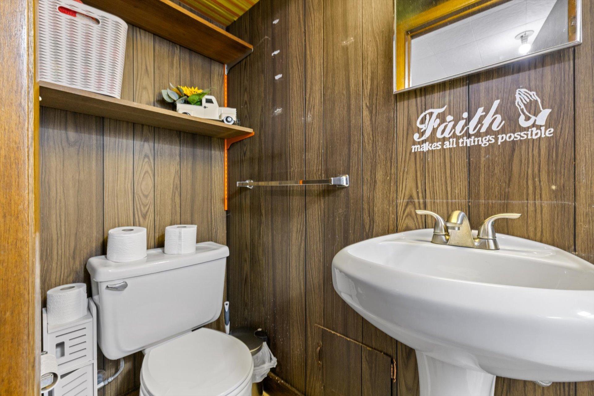 Lower level 3/4 bath with tiled shower, sink and toilet