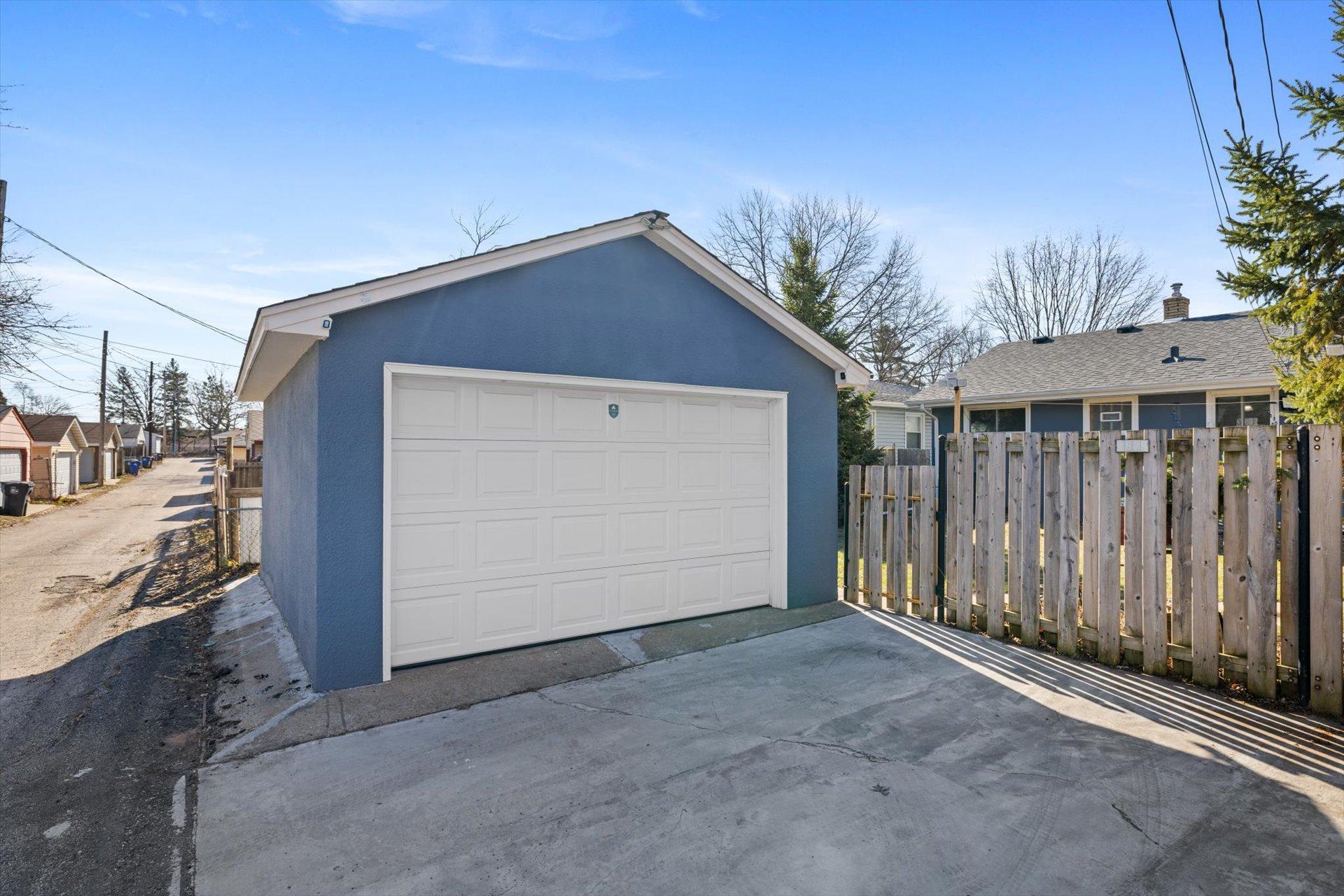 10x16 detached garage with concrete driveway