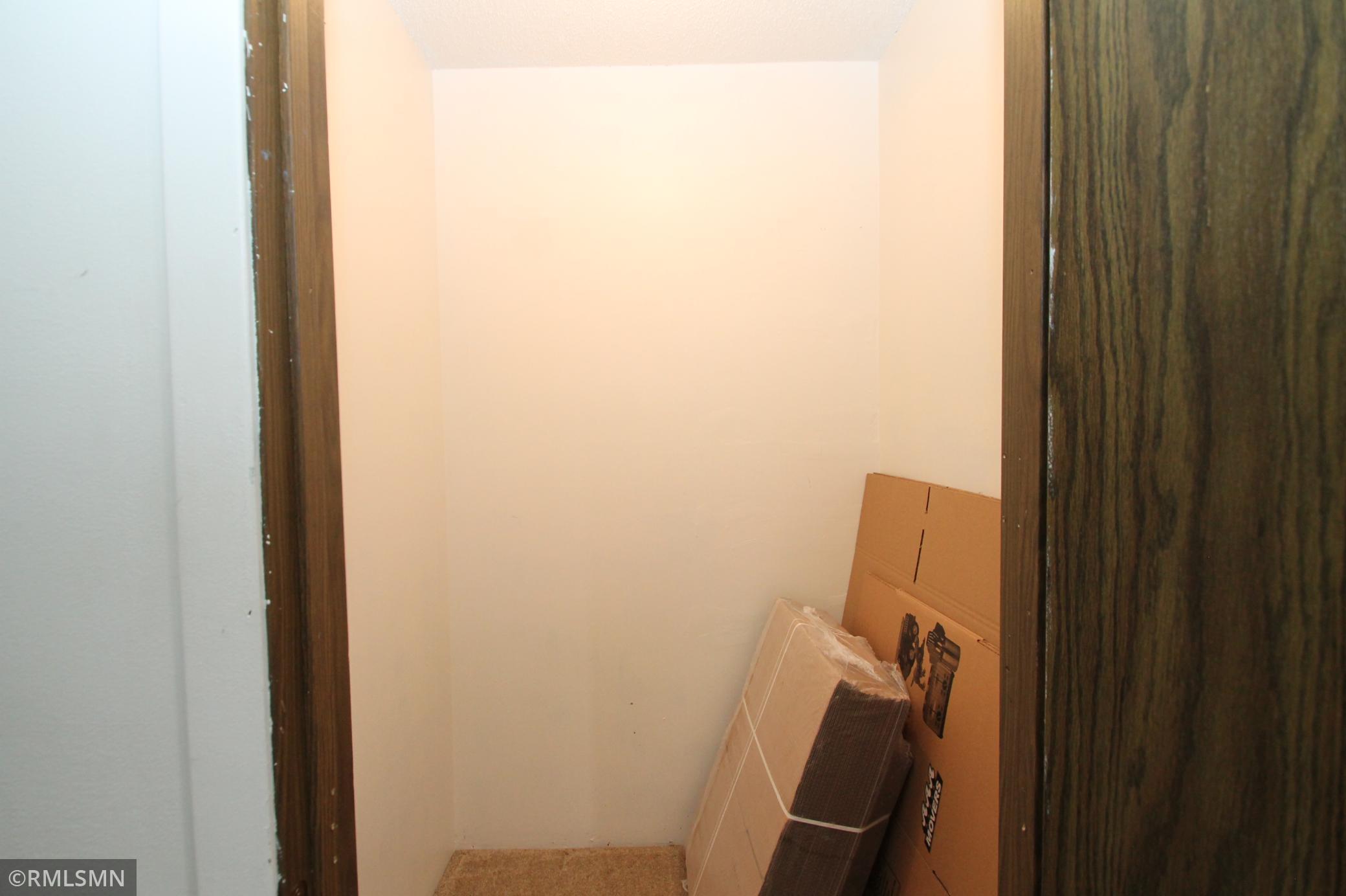Storage closet on upper level.