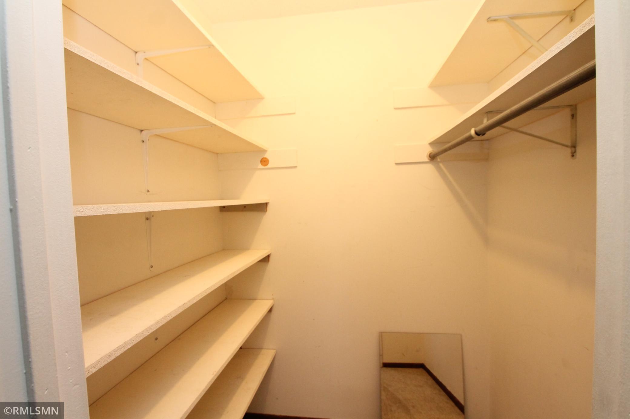 Primary bedroom walk-in closet.
