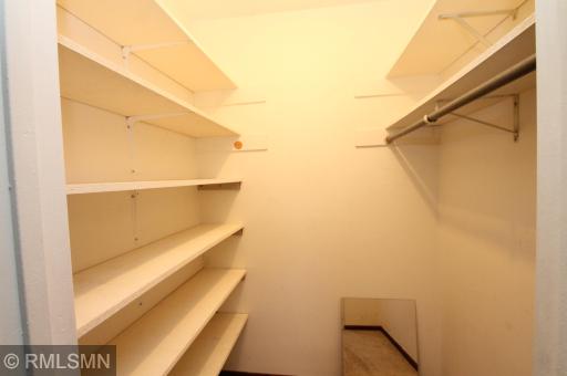 Primary bedroom walk-in closet.