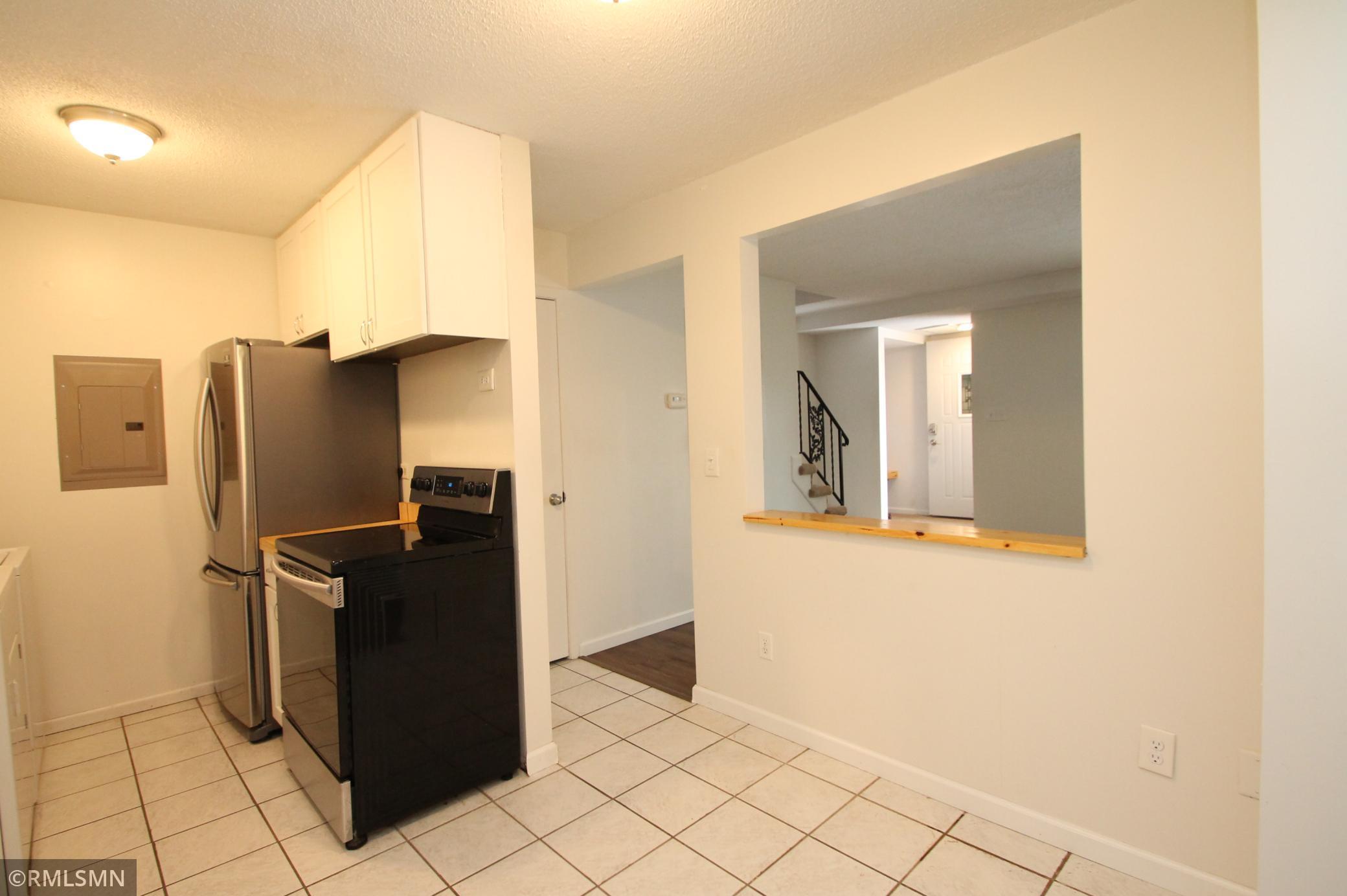 Room for a table and chairs and open to the living room.