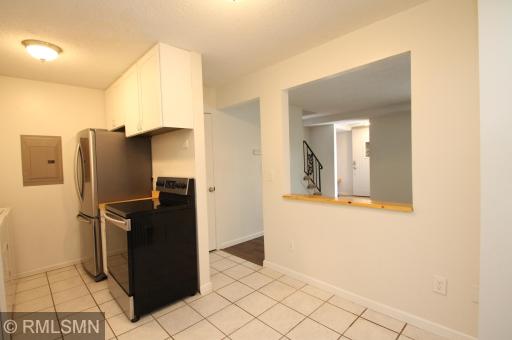 The kitchen eating area is open to the living room.