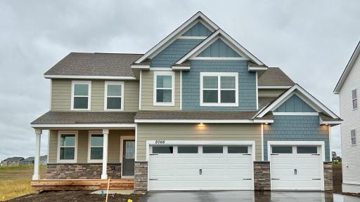 The Jameson provides a charming front porch entry and soaring roof lines. Sod, irrigation and landscape are included.