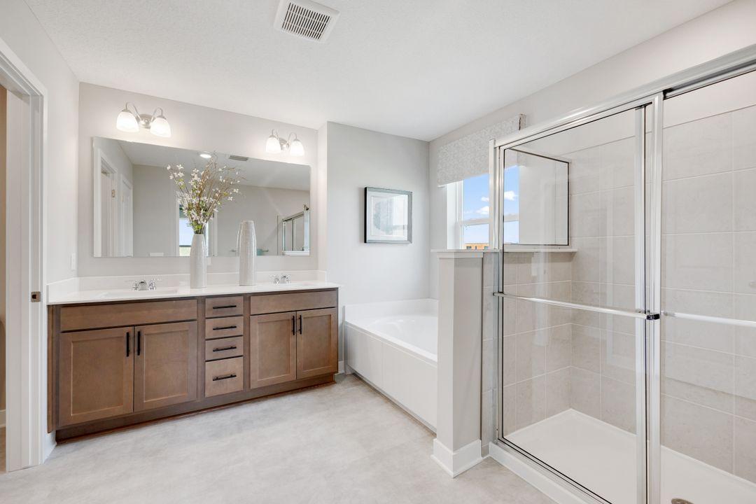 Private owners bath. Dual vanity, soaking tub and tiled shower! *Photos used are of a previous model for purposes of close representation.