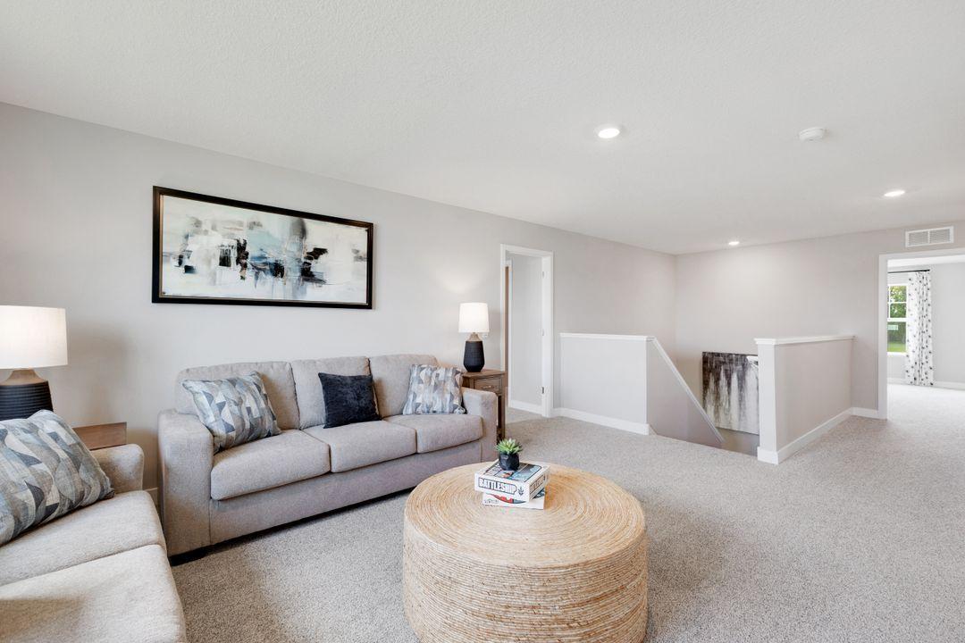 The upper level provides a large loft/2nd family room space. *Photos used are of a previous model home for purposes of close representation.