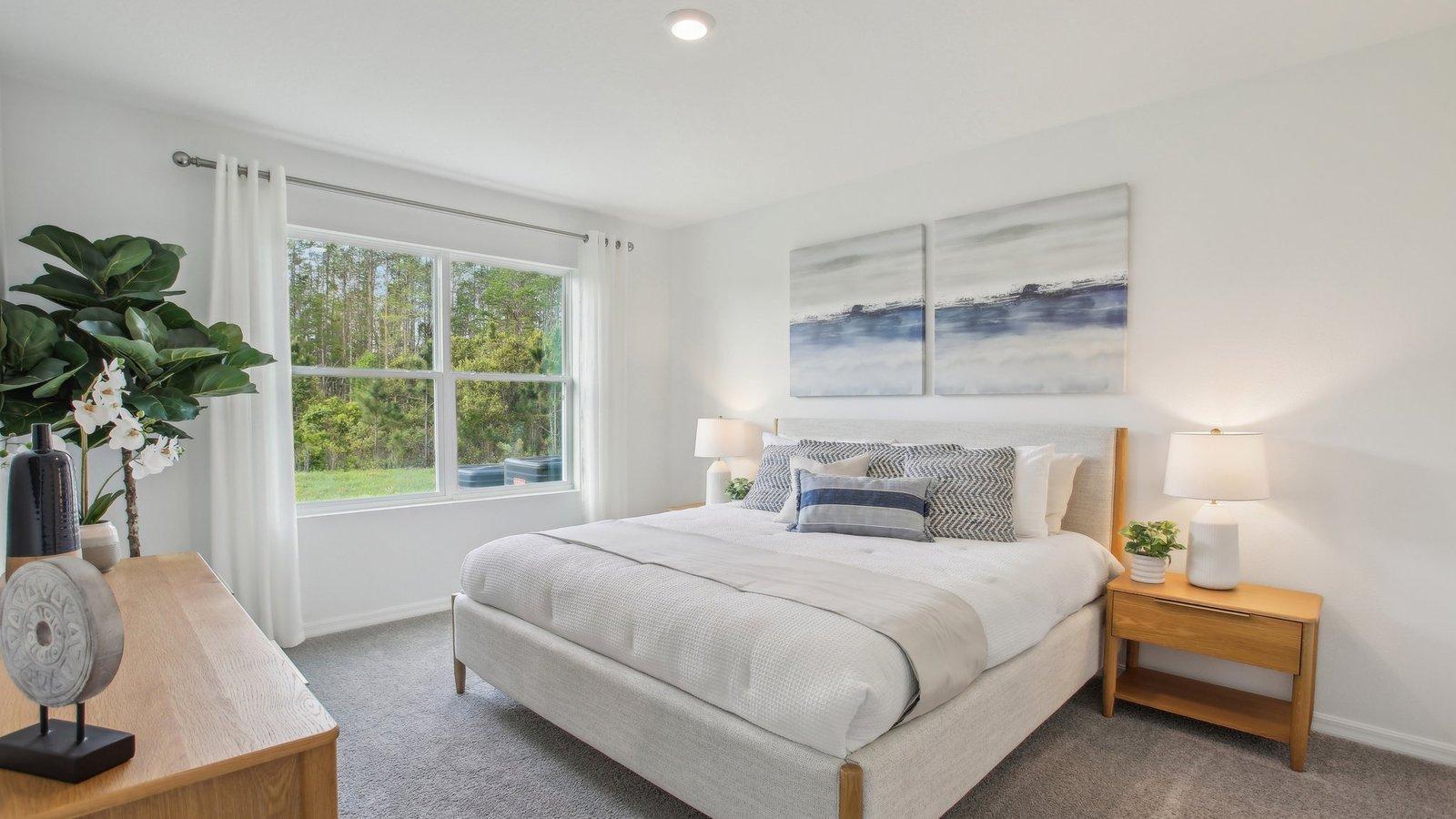 Primary suite. Spacious main floor bedroom with walk-in closet and private bath.