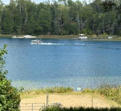 Boot Lake, with a maximum depth of 110 feet, is renowned for its water clarity & diverse fish populations, including walleye, making it ideal for fishing, kayaking, waterskiing, swimming & relaxing on your level, sandy beach.
