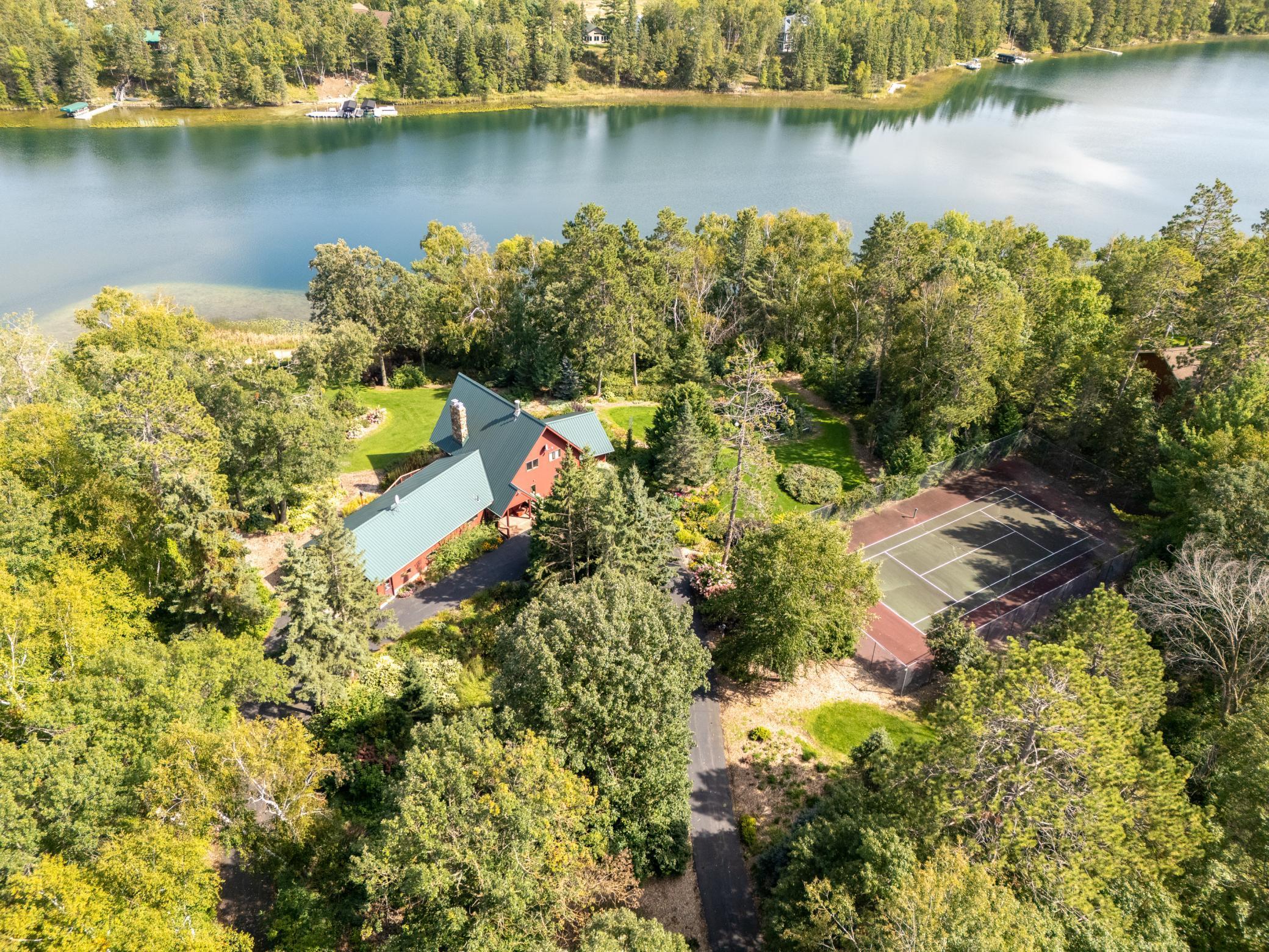 The entire lot 6.9 acre lot is fenced and secured by entry gates. The tennis/sport court is surrounded by a 10' fence. Truly a stately property for getaways or to make your forever home.