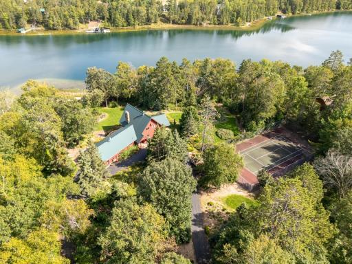 The entire lot 6.9 acre lot is fenced and secured by entry gates. The tennis/sport court is surrounded by a 10' fence. Truly a stately property for getaways or to make your forever home.