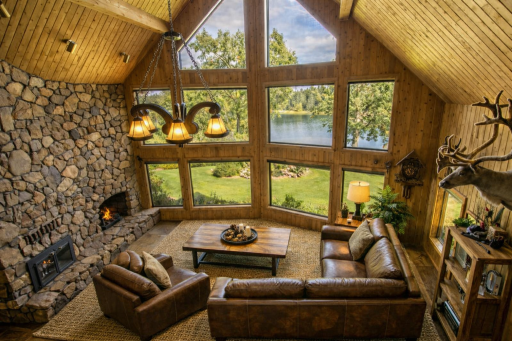 THhis photo has been virtually staged to depict a different flooring and the leather sectional, chair and table were added.
