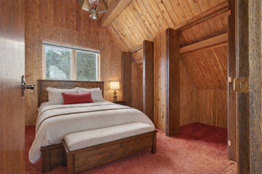 One of two upstairs bedrooms with both featuring vaulted ceilings and double closets.