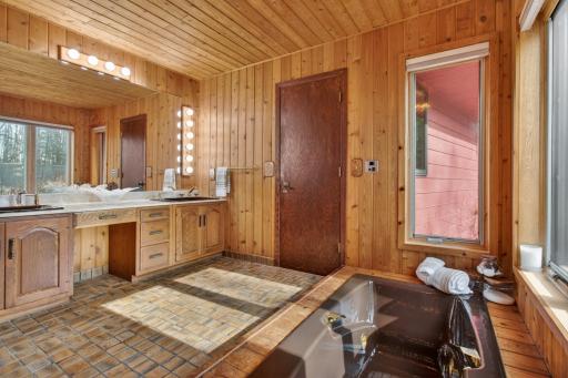 Spacious owners full bath with a whirlpool tub, dual vanity and separate shower.