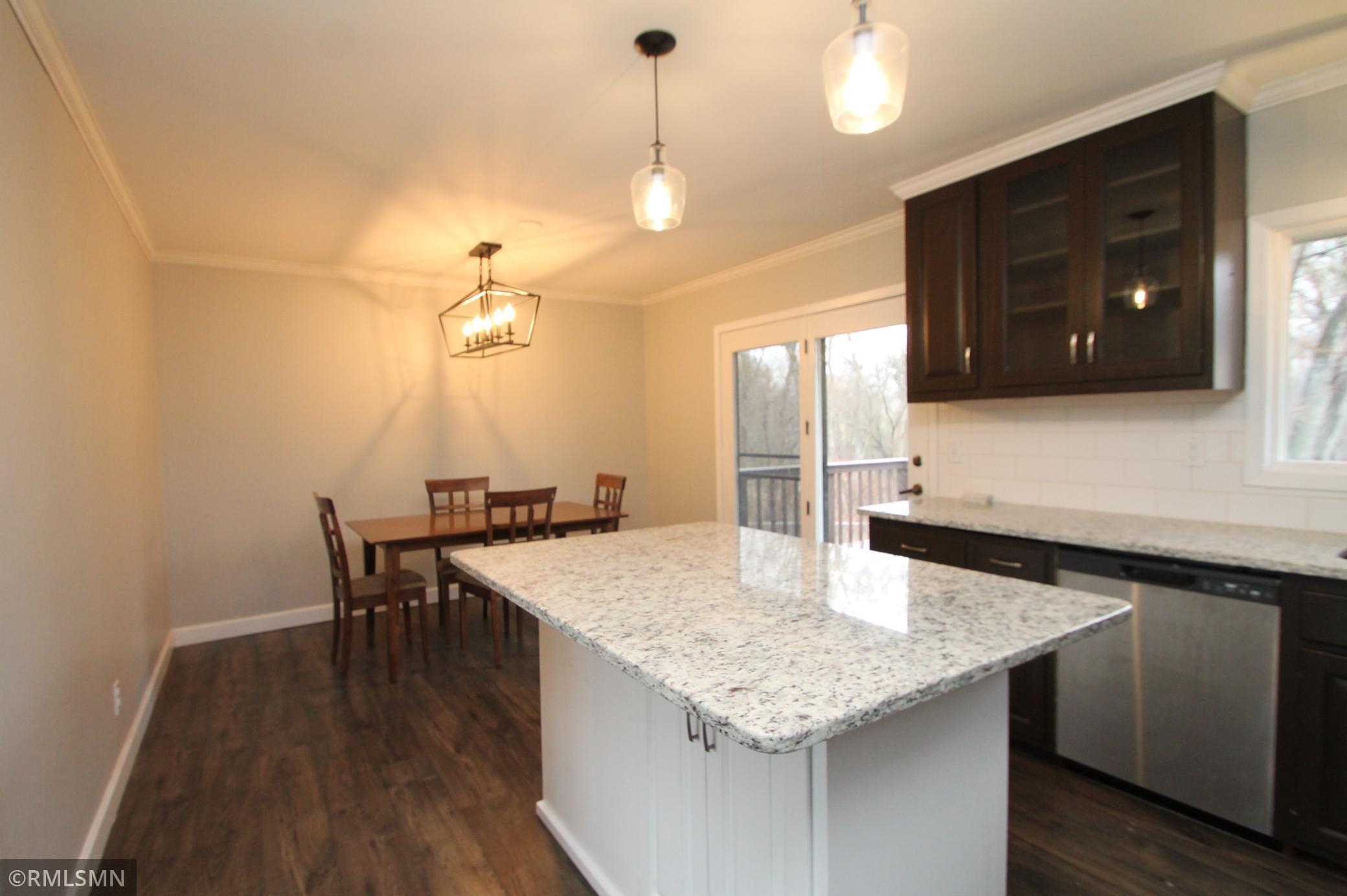 Big dining area and atrium door leads to the deck overlooking the back yard.