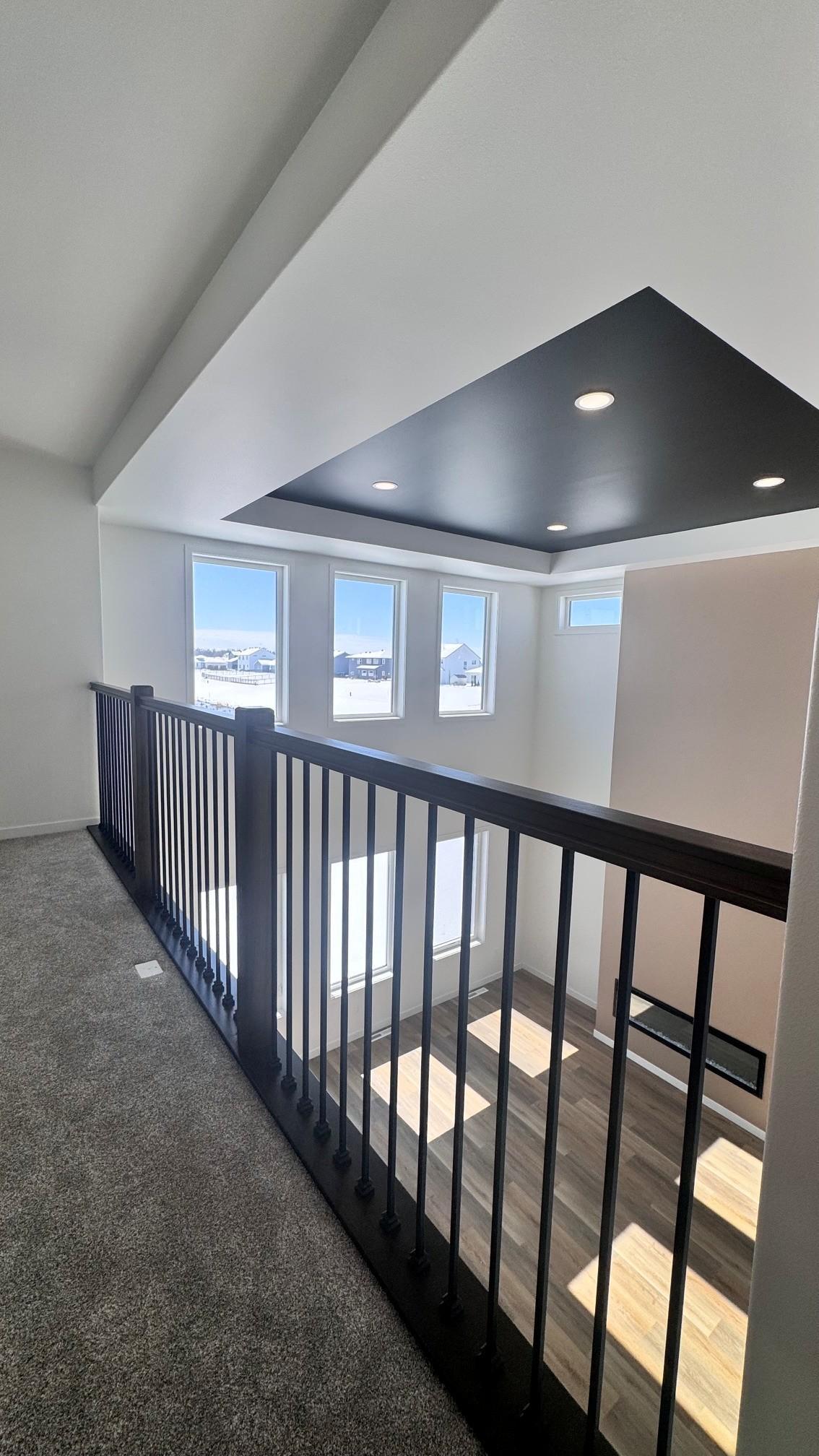 Double Volume great room-Primary bedroom view.jpg