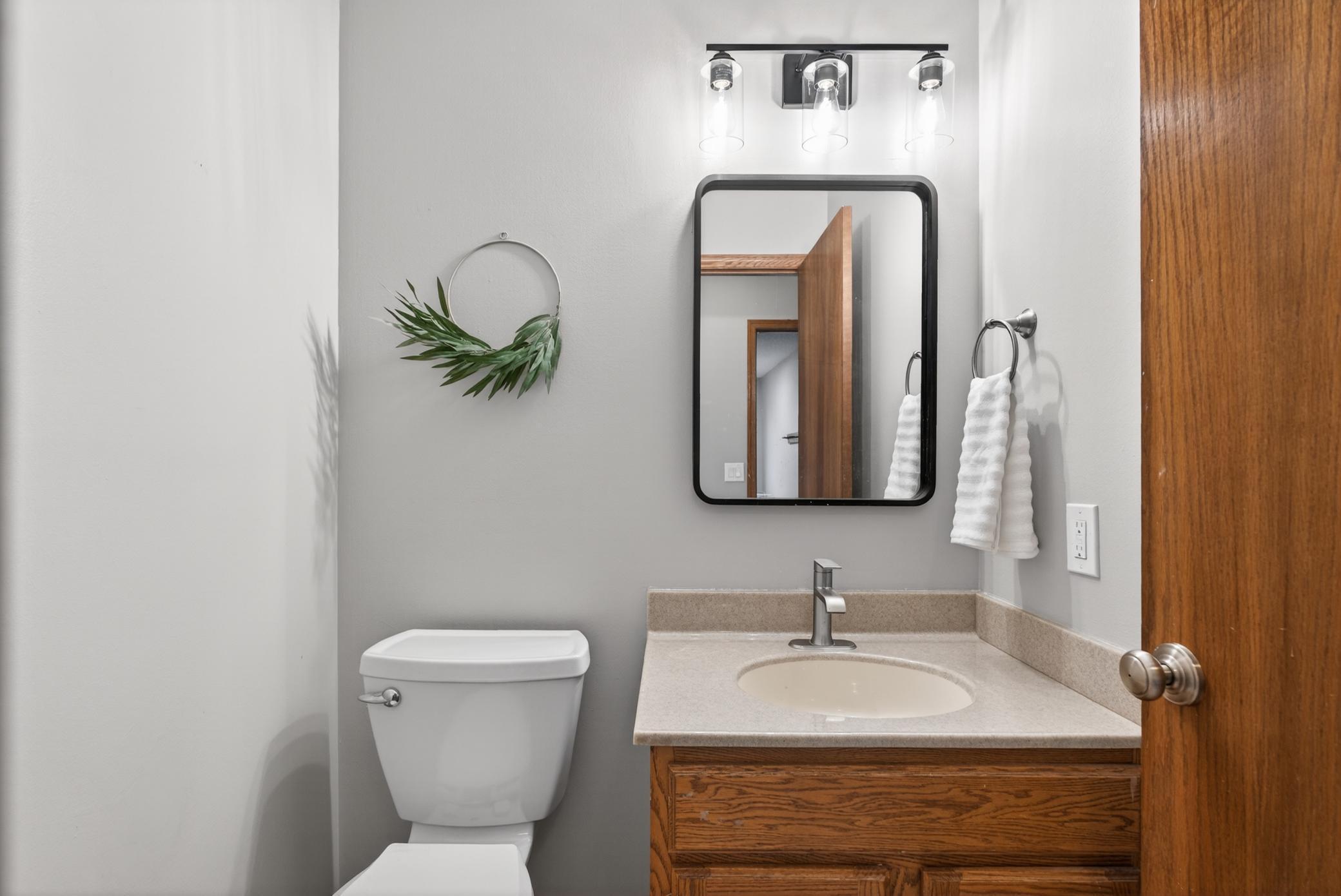 1/2 bath conveniently located right off kitchen.