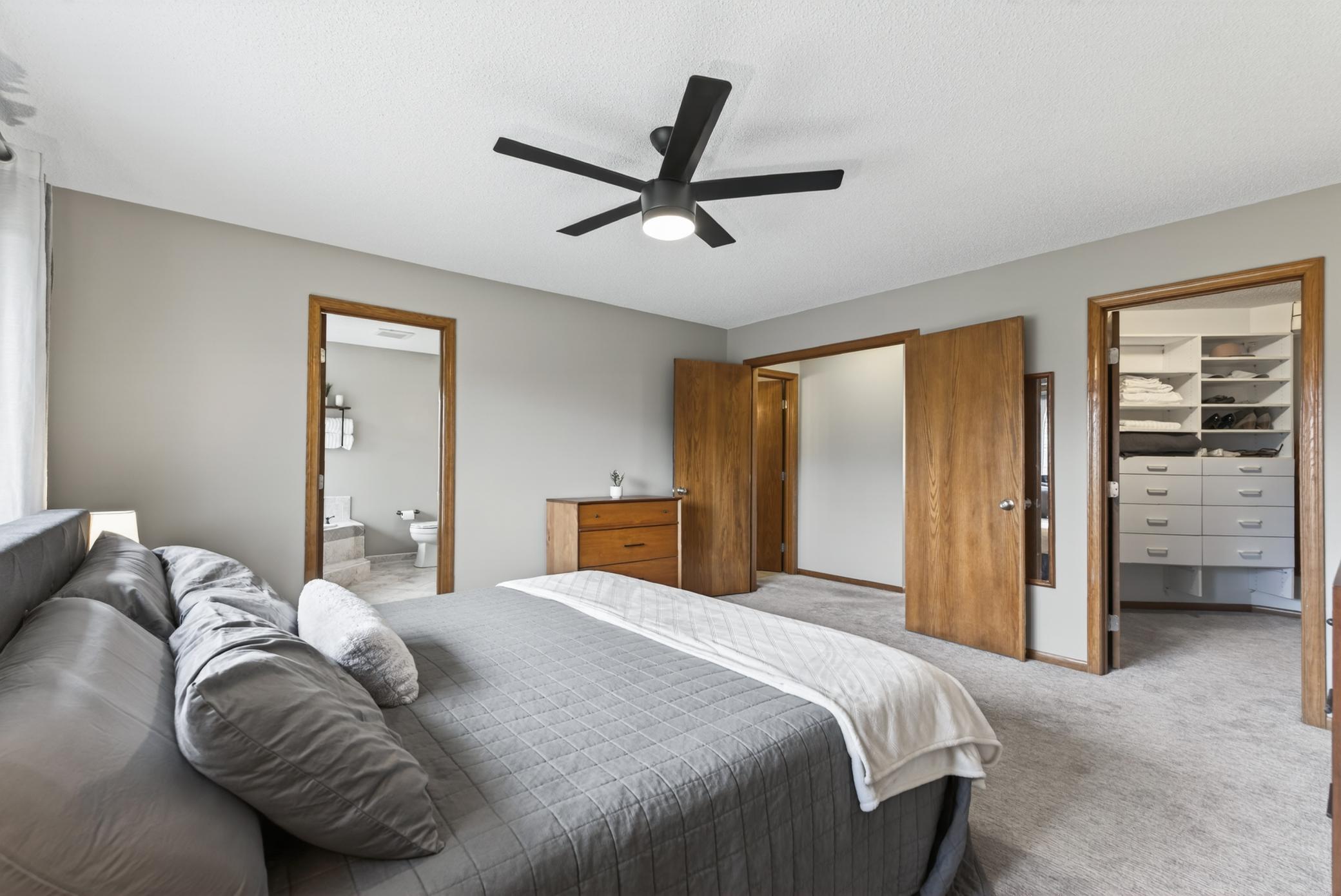 Primary suite features double doors, walk-in closet and private bath.