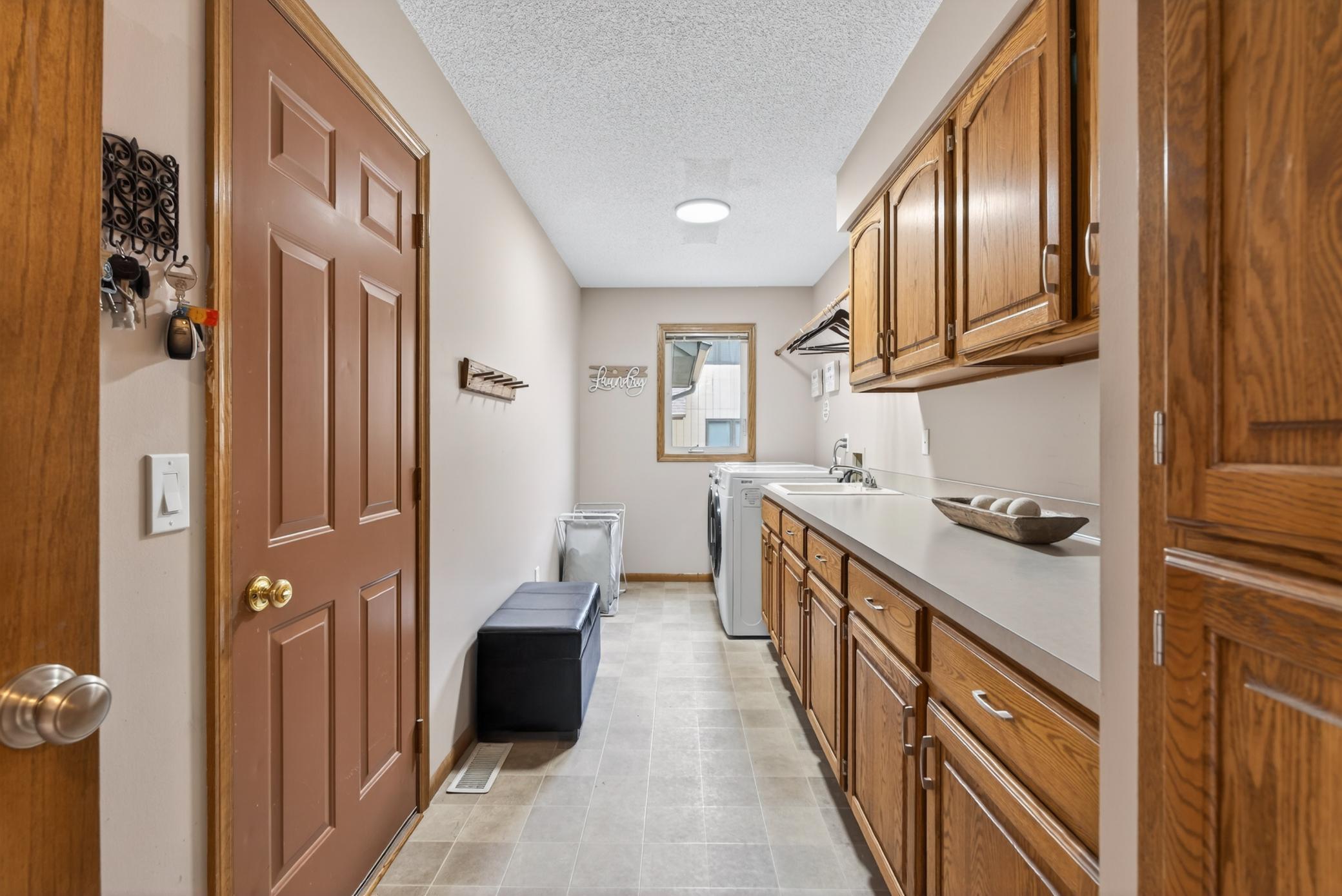 Main floor laundry room doubles as a great mud room space coming in from garage.