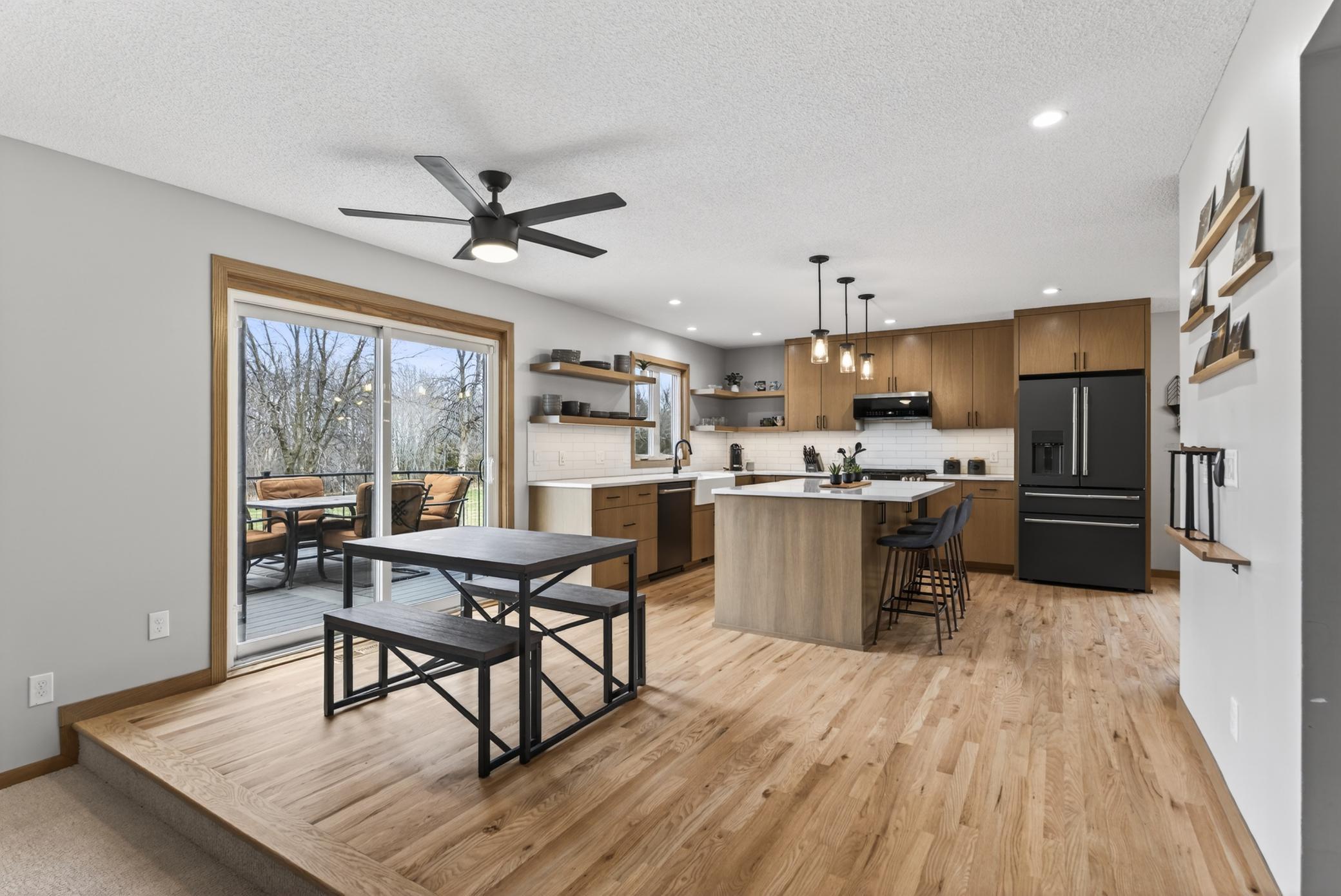Multiple dining spaces off kitchen.