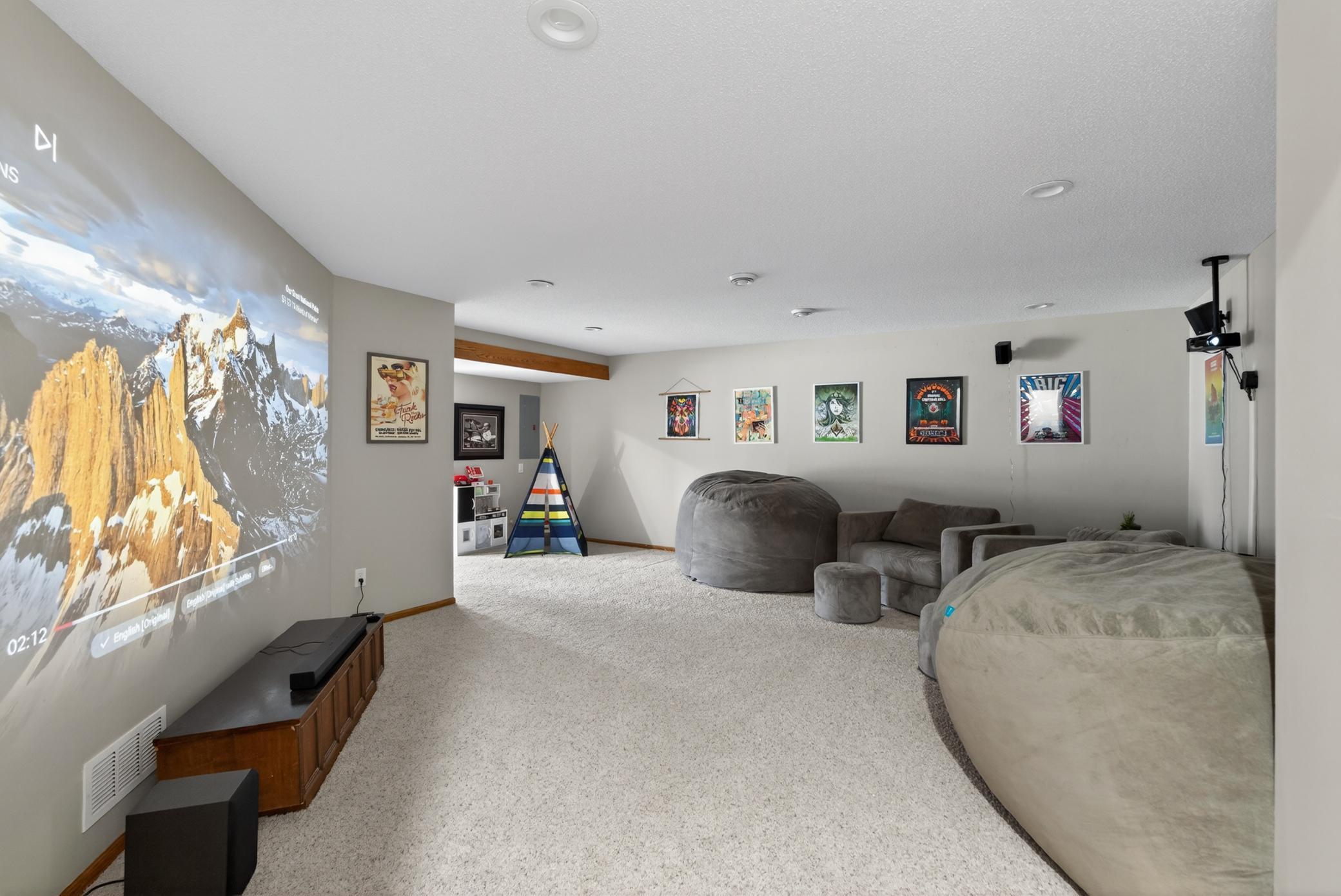 Projector room renovated with newly raised ceilings, additional supply and return registers, and recessed lighting.