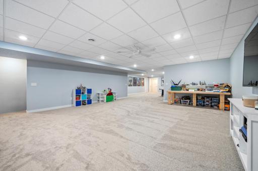 The spacious lower level provides plenty of room for kids to roam, play, and enjoy their own dedicated space for fun and activities.