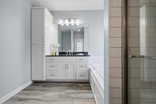 The master suite features beautifully crafted cabinetry that adds both elegance and practical storage.