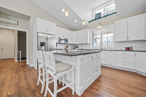 Enjoy cooking and gathering in this large, light-filled kitchen that feels open, fresh, and inviting.