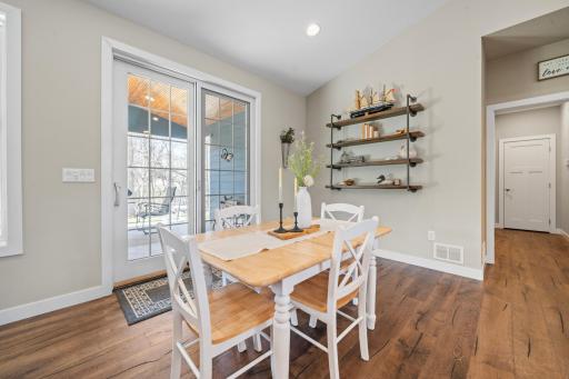 Positioned adjacent to a private patio, this kitchen area providing a calm and inviting view for everyday dining and conversation.