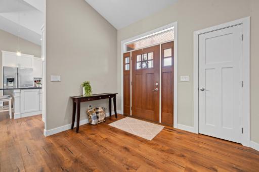 The grand front entry creates a welcoming first impression, offering plenty of room for guests to arrive and gather comfortably.