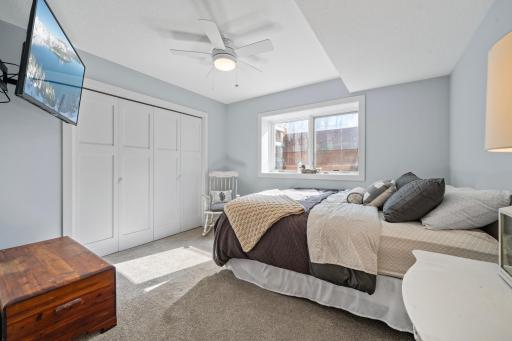 The lower level features a nice bedroom filled with natural sunlight, creating a bright and comfortable retreat.
