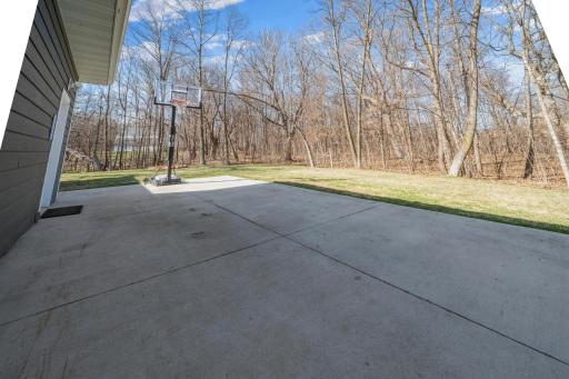 A bonus concrete pad expands your outdoor living space, ideal for games, activities, and active play.