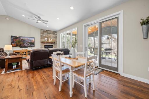 The kitchen table is perfectly positioned to overlook a private patio, creating a peaceful setting for everyday meals and relaxed gatherings.