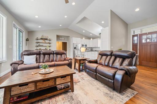 The living room and kitchen flow seamlessly together, creating an open and connected space that makes it easy to share conversations while cooking, relaxing, or entertaining.