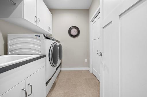 Convenient main-level laundry adds everyday ease, keeping household tasks accessible and efficient right where you need them.