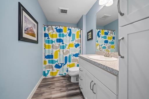 The bathroom is well-appointed, offering a clean, comfortable space with thoughtful finishes for everyday convenience.