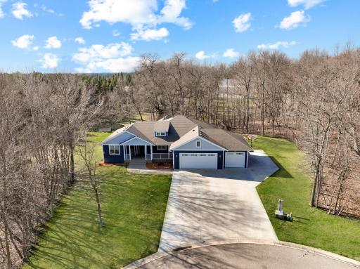 An oversized concrete pad extends the outdoor living space, offering a fun and versatile area for basketball, hopscotch, jump rope, and everyday active play.