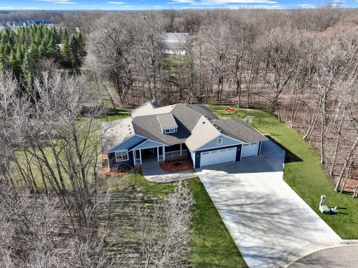 Surrounded by private woods, the home offers a peaceful natural setting with added privacy and a beautiful wooded backdrop in every season.