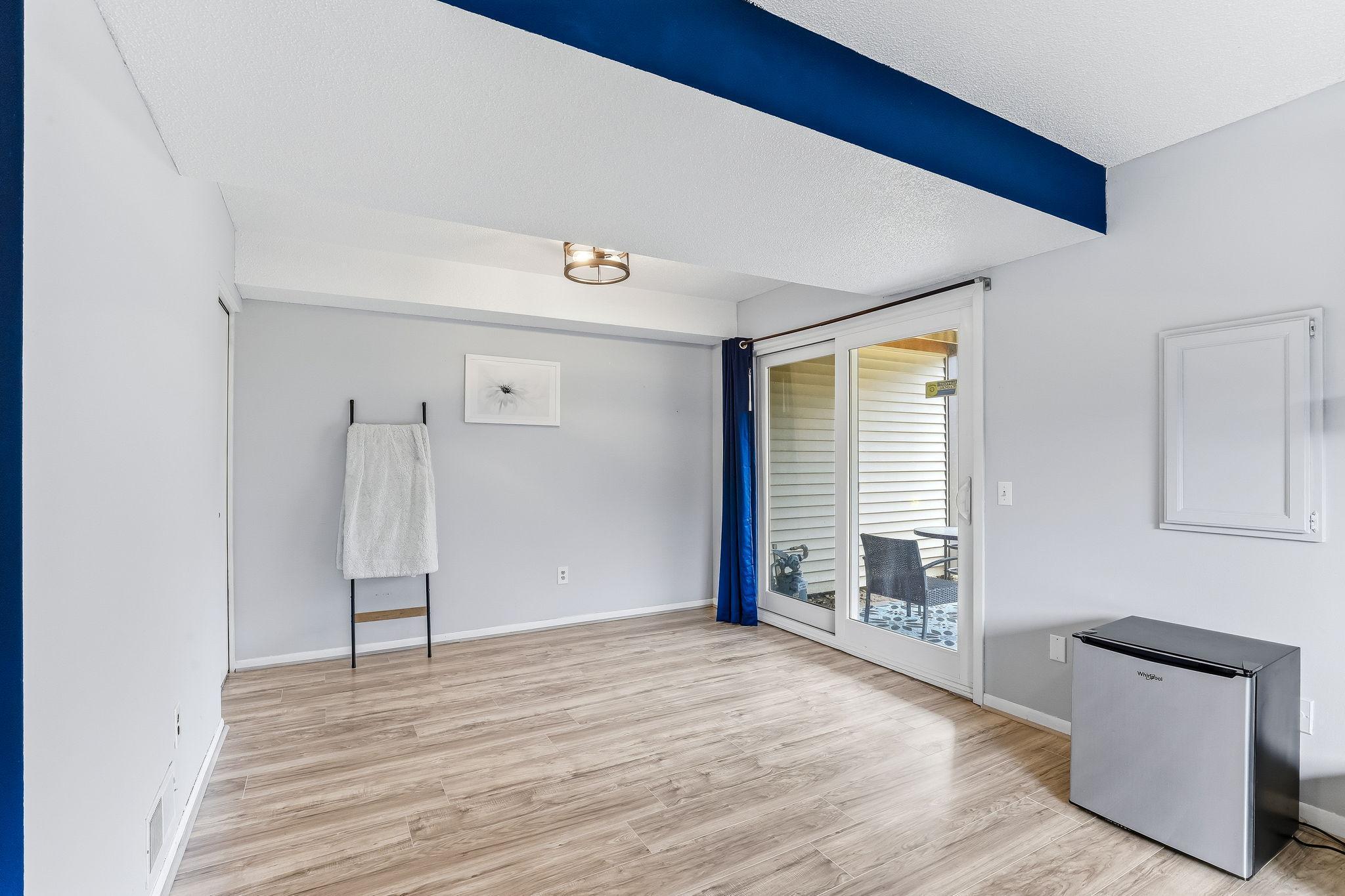 Walkout access to the backyard extends the lower-level living space, bringing in natural light and outdoor connection.