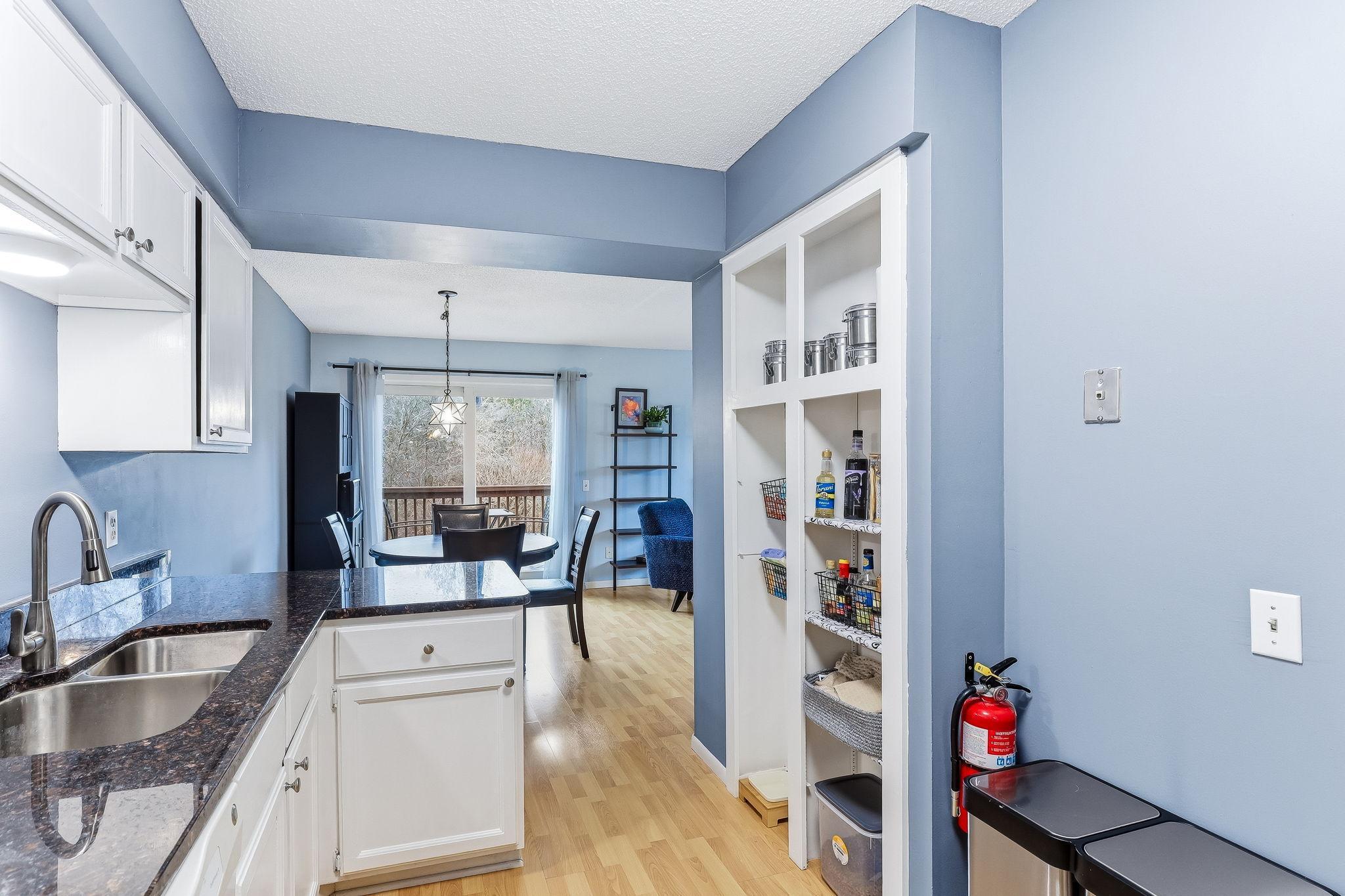 Kitchen with open sightlines to dining and living spaces, creating a connected layout that supports both daily living and entertaining.