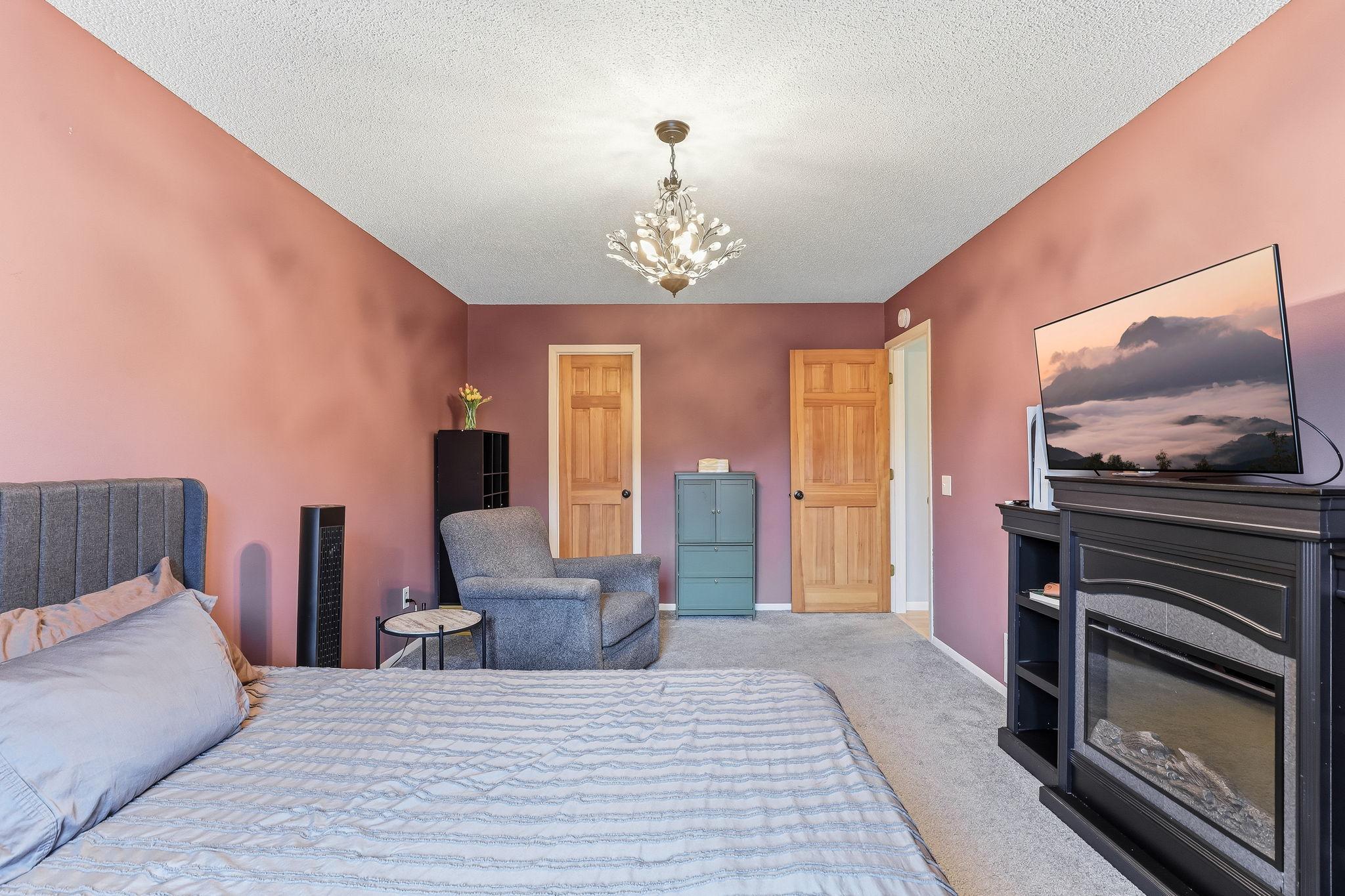 Bedroom with additional space for seating or storage, offering flexibility beyond a standard layout.