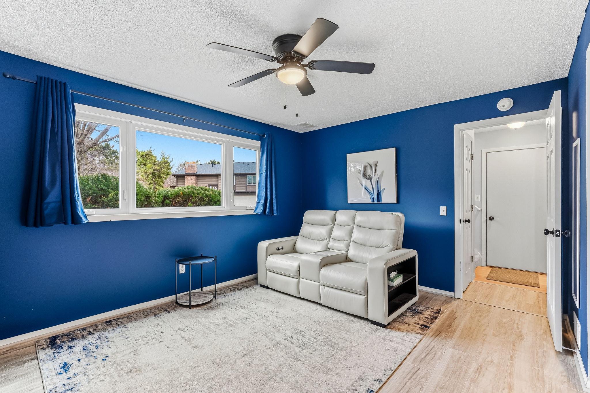 Spacious lower-level living area with flexible layout for media, recreation, or additional living space.