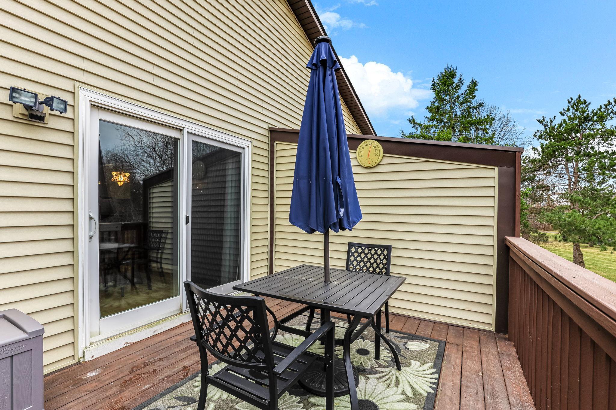 Private deck with space for outdoor dining, offering easy access from the interior and a comfortable setting for everyday use.