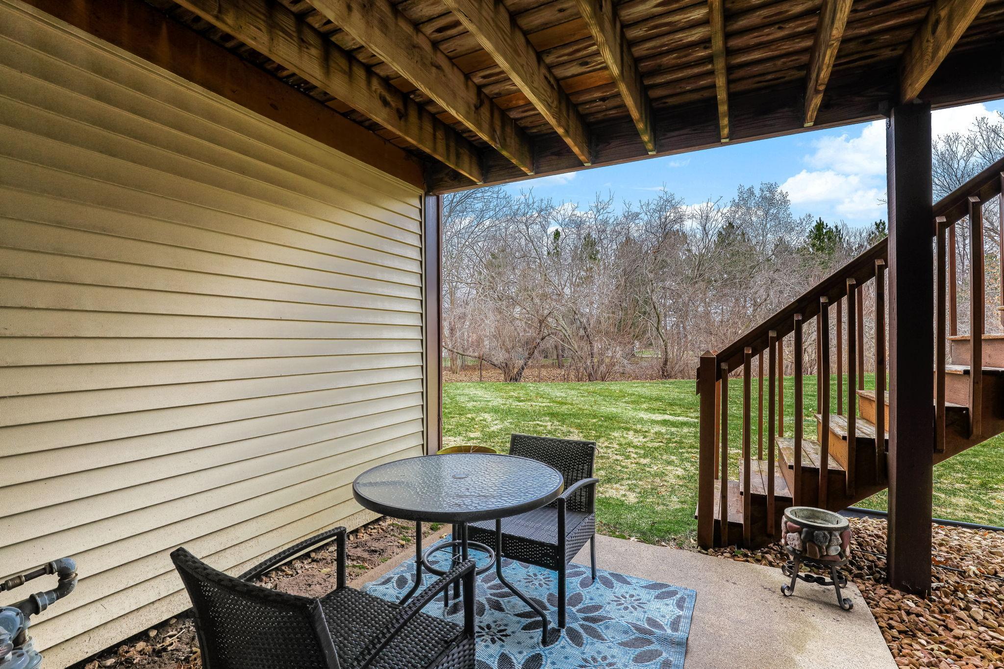 Covered patio space offers a shaded outdoor area for relaxing or entertaining just off the lower level.