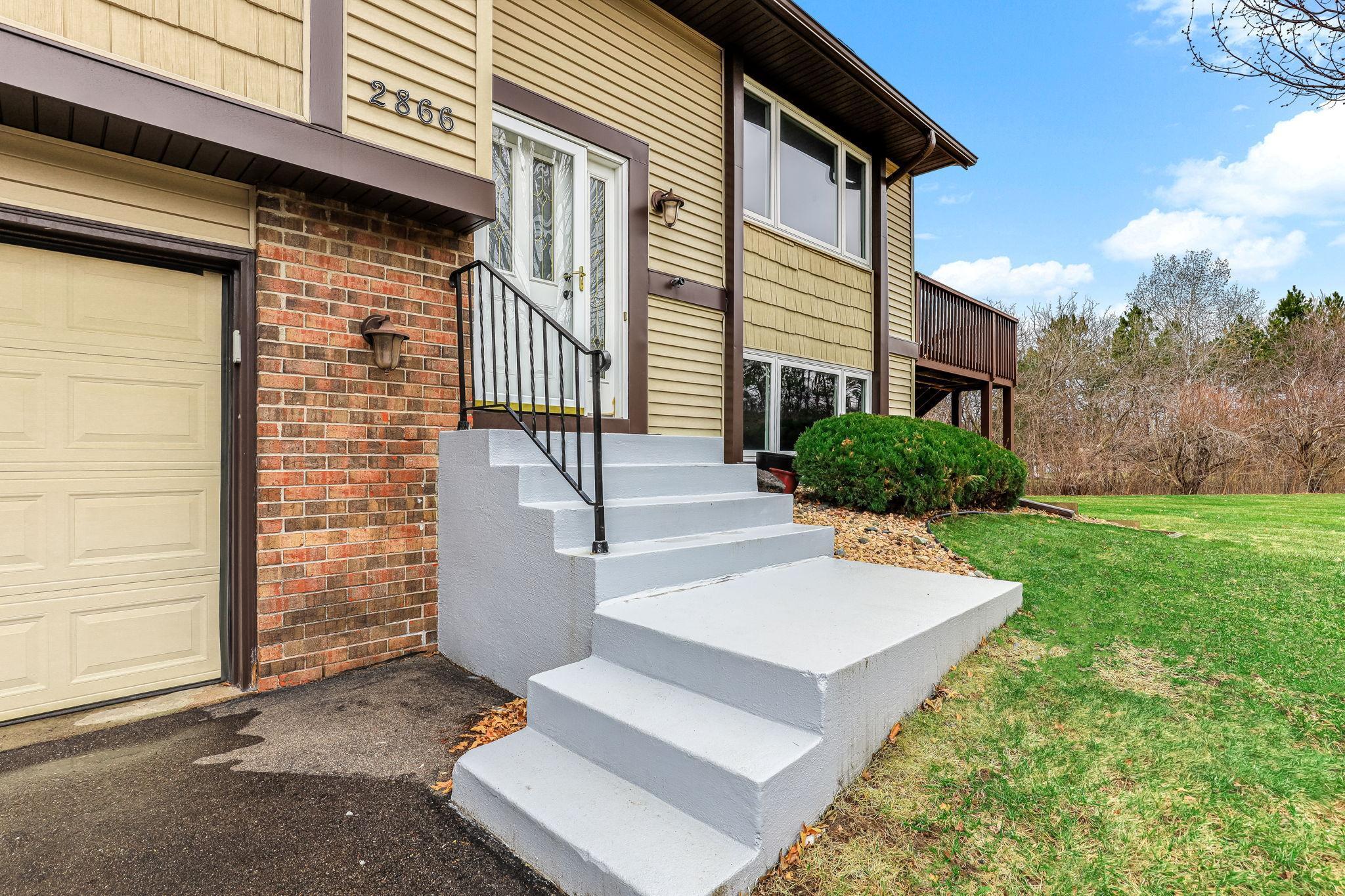Welcoming front entry with updated steps and a clean, refreshed approach that creates a strong first impression.