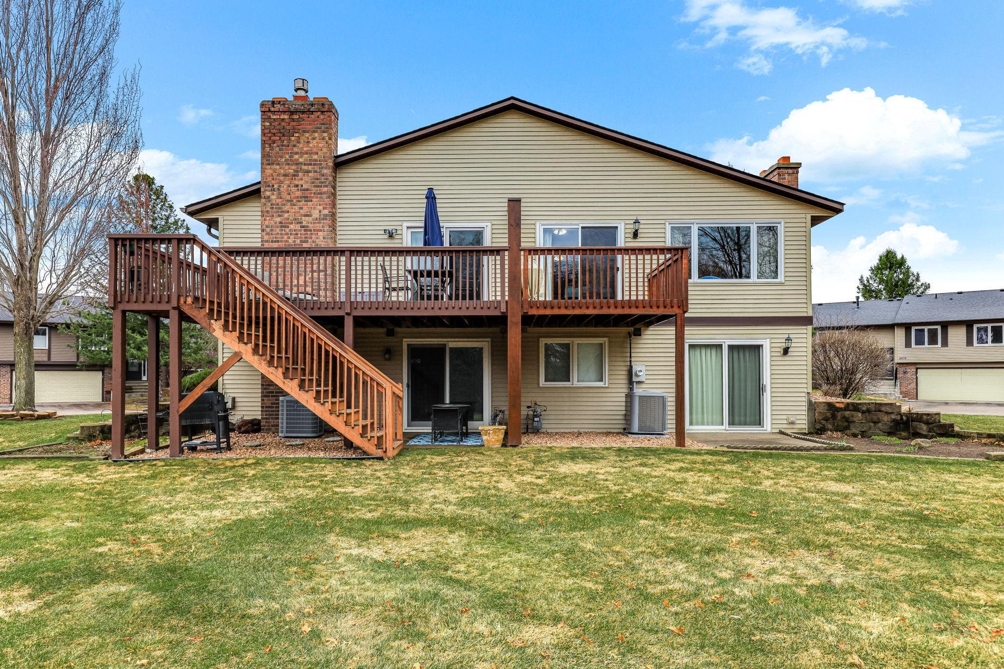 Full view of the home’s rear elevation highlighting multi-level outdoor living and functional layout.