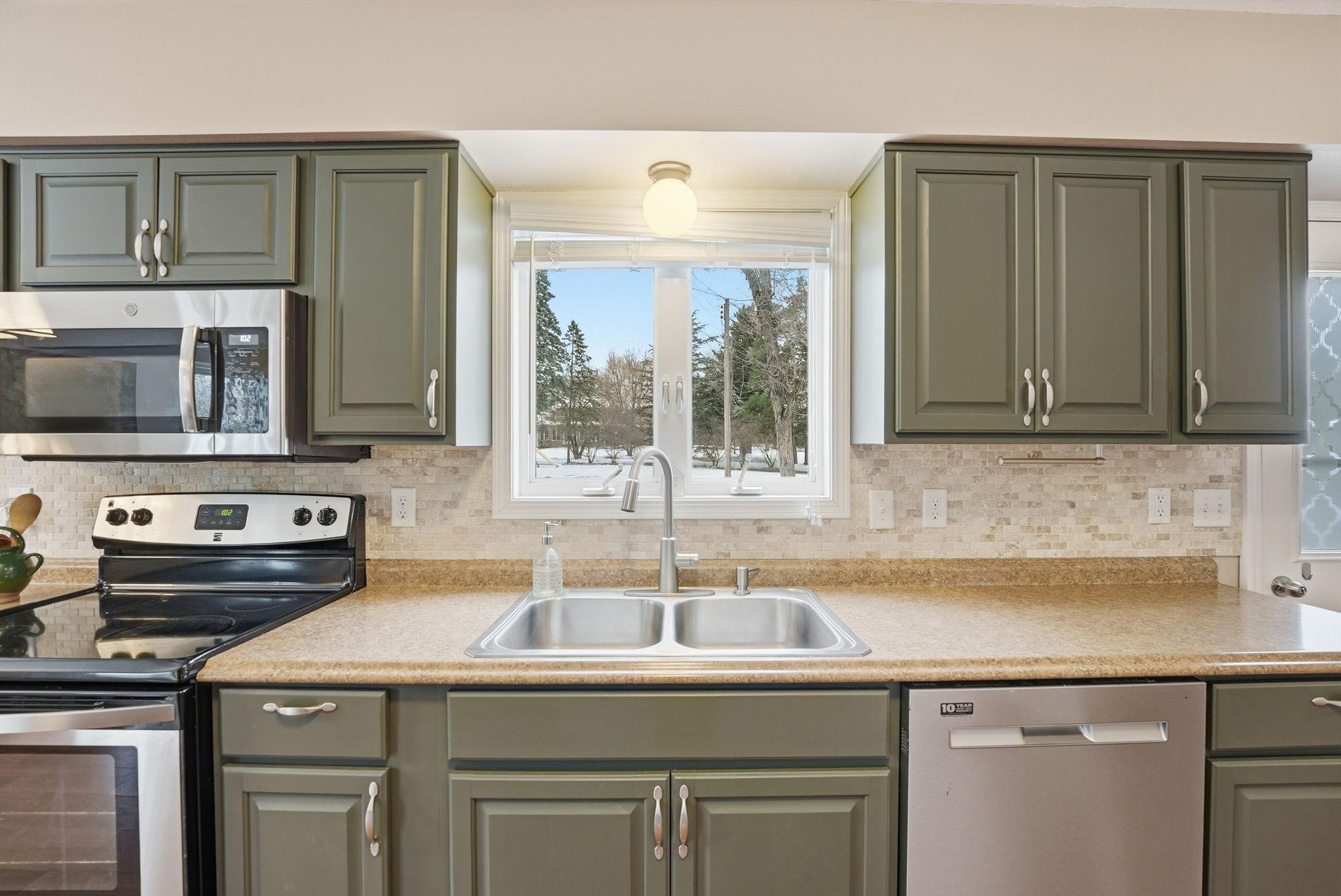 kitchen sink overlooks the backyard