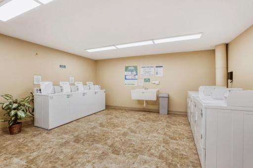 One of two laundry rooms with commercial washers and dryers for fast laundry.